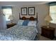 Inviting bedroom with serene decor, soft bedding, and sunny windows creates a peaceful retreat at 4875 Hansard Ave, North Port, FL 34286