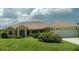 Charming single-story home with well-maintained lawn and attached two-car garage at 4875 Hansard Ave, North Port, FL 34286