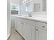 Bathroom vanity with sink, mirror, cabinet storage and tile floors at 5225 20Th N St, St Petersburg, FL 33714