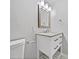 Clean bathroom with a white vanity, a granite countertop, and updated fixtures at 5225 20Th N St, St Petersburg, FL 33714