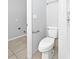 This powder room has a toilet, shower and towel rack for convenience at 5225 20Th N St, St Petersburg, FL 33714