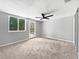 This cozy bedroom has a ceiling fan, carpet floors and a door that leads to the backyard area at 5225 20Th N St, St Petersburg, FL 33714