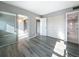 Bedroom with sliding glass doors leading to a screened porch, and closet with mirrored doors at 6100 12Th S St # 313, St Petersburg, FL 33705