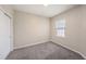 Cozy bedroom with plush gray carpeting, a bright window, and a neutral color scheme at 6703 Citrus Creek Ln, Tampa, FL 33625