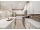 Bright kitchen with white cabinets, stainless steel appliances, and tile backsplash at 6703 Citrus Creek Ln, Tampa, FL 33625