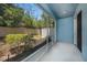 Enclosed patio with screen overlooking a landscaped yard with privacy fence at 6703 Citrus Creek Ln, Tampa, FL 33625