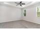 Spacious primary bedroom with tray ceiling, carpeted floors, and plenty of natural light at 7308 Hermes Ct, Apollo Beach, FL 33572