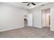 Spacious bedroom with neutral color palette, carpet flooring, and a ceiling fan at 7308 Hermes Ct, Apollo Beach, FL 33572