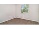 Bedroom featuring a window with natural light and carpet flooring at 7308 Hermes Ct, Apollo Beach, FL 33572