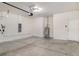 A large garage with an insulated garage door and a water heater at 7308 Hermes Ct, Apollo Beach, FL 33572