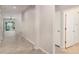 Hallway featuring tile floors and neutral wall paint leading to the living space and other rooms at 7308 Hermes Ct, Apollo Beach, FL 33572