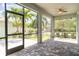 Covered lanai with brick flooring and view of fenced backyard at 7308 Hermes Ct, Apollo Beach, FL 33572