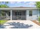 Spacious brick patio with an attached screened-in enclosure, offering the best of indoor/outdoor living at 7308 Hermes Ct, Apollo Beach, FL 33572
