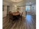 Elegant dining area showcasing a wood table with ornate chairs and views of the front entrance at 1212 Georgia Trace Ave, Valrico, FL 33596
