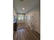 Bright foyer with hardwood floors, stylish decor, and a welcoming entrance with double doors at 1212 Georgia Trace Ave, Valrico, FL 33596