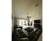 Spacious living room with a ceiling fan, access to a patio, and seamless flow to other living spaces at 1212 Georgia Trace Ave, Valrico, FL 33596