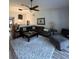 Inviting living room with cozy seating, ceiling fan, and stylish decor, perfect for relaxation at 1212 Georgia Trace Ave, Valrico, FL 33596