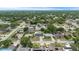 Aerial showcases varied homes in a residential area; some homes have private pools, solar panels, and well-kept yards at 14506 Sutter Pl, Tampa, FL 33625