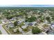 Wide aerial view showcasing neighborhood homes with pools, landscaping, and street layout in a residential community at 14506 Sutter Pl, Tampa, FL 33625