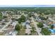 Neighborhood aerial view features tree-lined streets and various single-Gathering homes with private pools at 14506 Sutter Pl, Tampa, FL 33625
