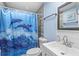 Bathroom featuring a shower/tub combo with dolphin shower curtain at 14506 Sutter Pl, Tampa, FL 33625