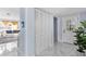Hallway featuring modern finishes, closet space, and natural light, leading to various parts of the home at 14506 Sutter Pl, Tampa, FL 33625