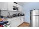 Bright kitchen with stainless steel appliances, white cabinets, and ample counter space at 14506 Sutter Pl, Tampa, FL 33625