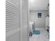 Practical laundry area with washer, dryer, storage cabinets, and tiled floors, providing a convenient utility space at 14506 Sutter Pl, Tampa, FL 33625