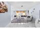 Comfortable living room featuring modern decor, plush seating, and large windows providing natural light at 14506 Sutter Pl, Tampa, FL 33625
