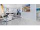 Spacious living room with stylish furniture, a modern fireplace, contemporary decor, and plenty of natural light at 14506 Sutter Pl, Tampa, FL 33625