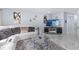 Inviting living room with a modern fireplace, plush seating, a stylish rug, and contemporary decor at 14506 Sutter Pl, Tampa, FL 33625