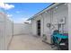 Enclosed patio provides a cozy outdoor space, adorned with decorative lighting and an access door to home at 14506 Sutter Pl, Tampa, FL 33625