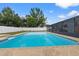 Beautiful backyard pool with patterned stone border, offering a refreshing oasis for relaxation and recreation at 14506 Sutter Pl, Tampa, FL 33625