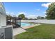 Backyard featuring a large swimming pool, enclosed patio, and fenced-in yard for privacy at 14506 Sutter Pl, Tampa, FL 33625