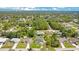 Aerial view of property showcasing neighborhood and surrounding trees at 2706 Flagami Ln, North Port, FL 34286