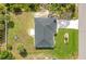 Drone shot of the property and its landscaping, showing proximity to street at 2706 Flagami Ln, North Port, FL 34286