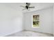 Well-lit bedroom with neutral walls and tile flooring, offering a comfortable and inviting atmosphere at 2706 Flagami Ln, North Port, FL 34286