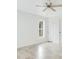 Bright bedroom with white walls and modern ceiling fan, showcasing the natural light and neutral colors at 2706 Flagami Ln, North Port, FL 34286