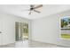 Well-lit bedroom with neutral walls, offering easy access to the outdoors and a serene atmosphere at 2706 Flagami Ln, North Port, FL 34286