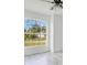 Well-lit bedroom with neutral walls, showcasing the natural light and ceiling fan at 2706 Flagami Ln, North Port, FL 34286