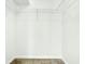 Walk-in closet with ample storage space, wire shelving and tile flooring for maximum organization at 2706 Flagami Ln, North Port, FL 34286