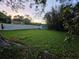 Spacious, well-maintained backyard with a white fence and a storage shed at 663 68Th S Ave, St Petersburg, FL 33705
