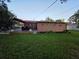 Spacious backyard featuring a fire pit patio and a deck with comfortable seating at 663 68Th S Ave, St Petersburg, FL 33705