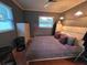 Bedroom featuring tiled floor, neutral walls, ceiling fan, one window and closet at 663 68Th S Ave, St Petersburg, FL 33705