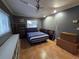 Bedroom featuring tiled floor, neutral walls, ceiling fan, storage and sun filled window at 663 68Th S Ave, St Petersburg, FL 33705