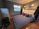 Bedroom featuring tiled floor, neutral walls, ceiling fan, one window and closet at 663 68Th S Ave, St Petersburg, FL 33705