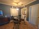 Cozy dining area featuring a modern light fixture, tile flooring, and neutral walls at 663 68Th S Ave, St Petersburg, FL 33705