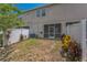 Backyard featuring a screen door and fenced yard at 8126 Muddy Pines Pl, Tampa, FL 33635