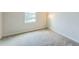Cozy bedroom with carpet flooring and a large window at 8126 Muddy Pines Pl, Tampa, FL 33635