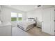 Serene bedroom with plenty of natural light, calming decor, and comfortable carpet flooring at 8126 Muddy Pines Pl, Tampa, FL 33635